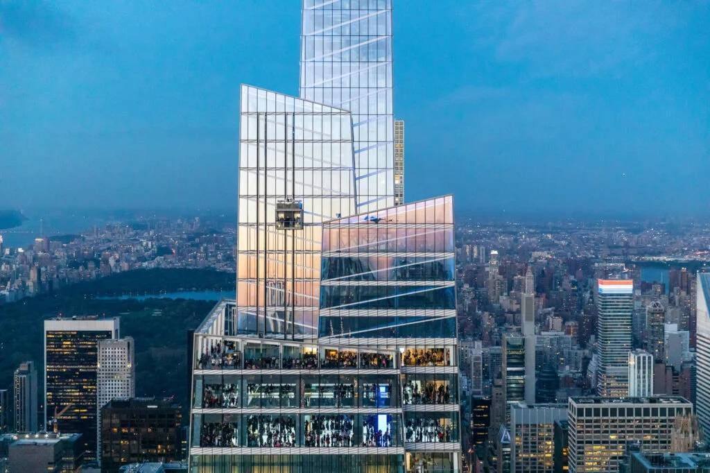 SUMMIT Ascent with a thrilling 12-story glass elevator journey, offering panoramic views of the NYC skyline.